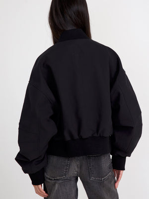 Sort bomberjakke med puffede ærmer og ribkant, perfekt til en afslappet stil. MEOTINE tilføjer et moderne touch.